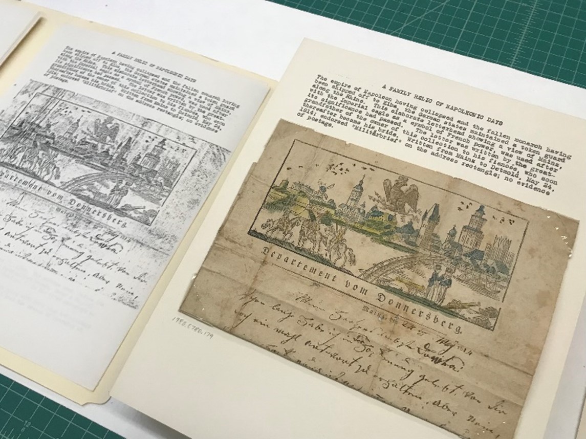 Photograph of collector’s album opened to pages with typed text and image of medieval drawings on right; on left, a black and white photocopy of the right page