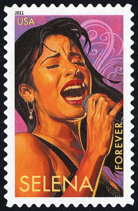 stamp featuring an illustration of Selena holding a microphone and singing