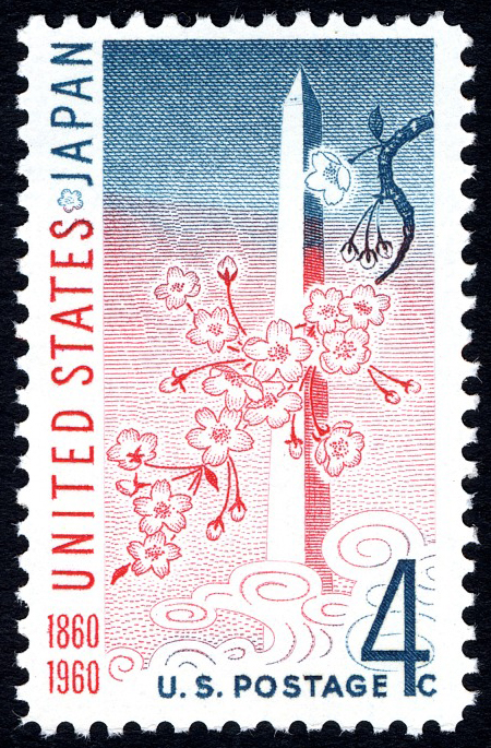 United States-Japan Treaty stamp featuring the Washington Monument and a cherry blossoms on a branch