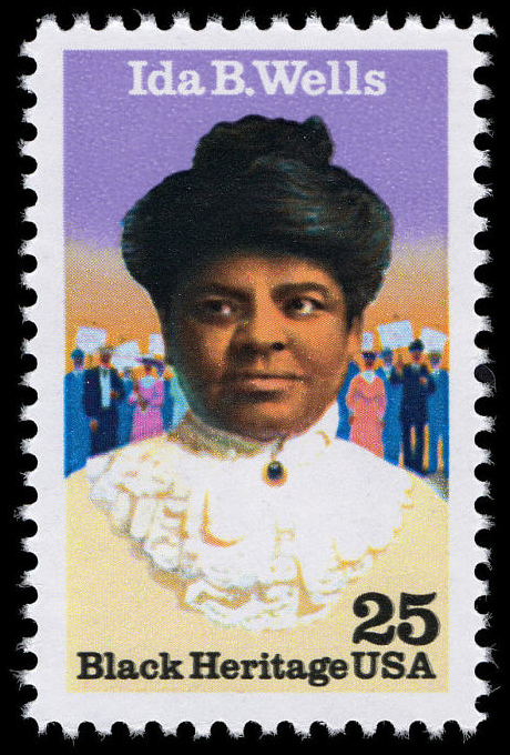 a 25-cent stamp with Ida B Wells, and African American woman, shown in portrait. She is facing the viewer and wearing a cream dress with a white ruffled collar, and her hair is in an updo. In the background are numerous figures holding signs.