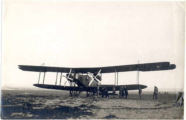 Photograph of personnel inspecting O/400 airplane