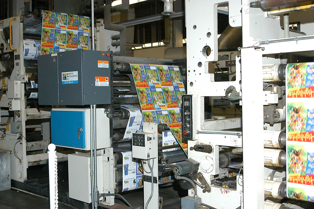 Highlights magazines are trimmed and then moved onto a conveyor that flips them into the proper position for mailing labels.