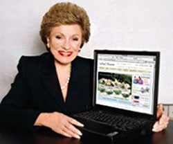 Lillian Vernon holding her computer