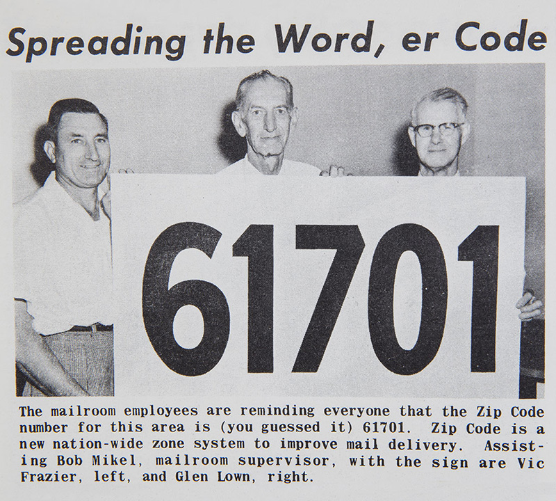 State Farm staff holding a large ZIP Code sign