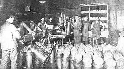 photo of men working at a pneumatic tube station