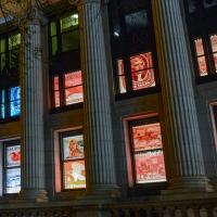 Front windows showing stamp images at night