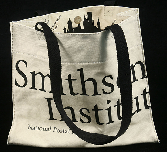 A tote bag with Smithsonian Institution written on it in ink.